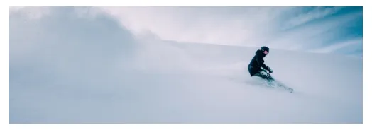 An Image block in checkout showing a wide photo of a snowboarder in fresh powder